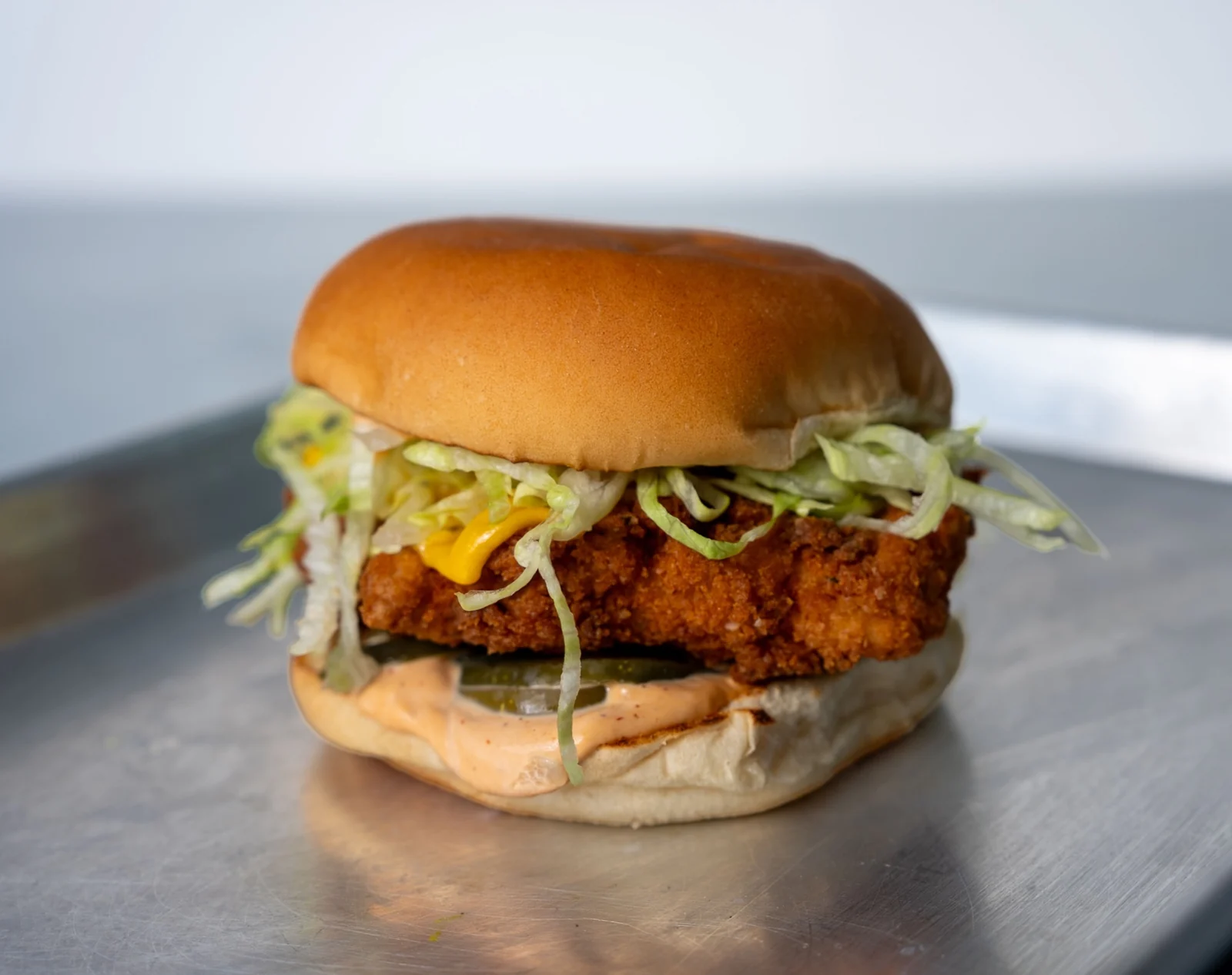 A crispy Mary’s chicken sandwich with lettuce and melted cheese