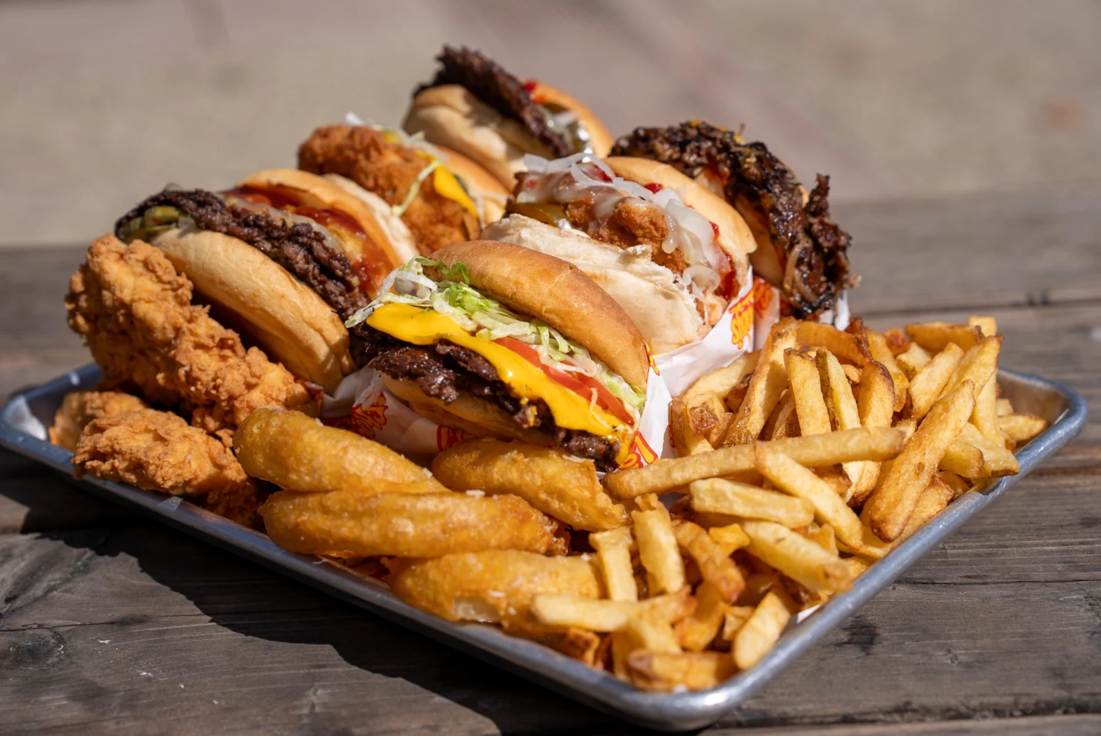 A generous tray of Shooby’s burgers, chicken sandwiches, tenders, fries and onion rings